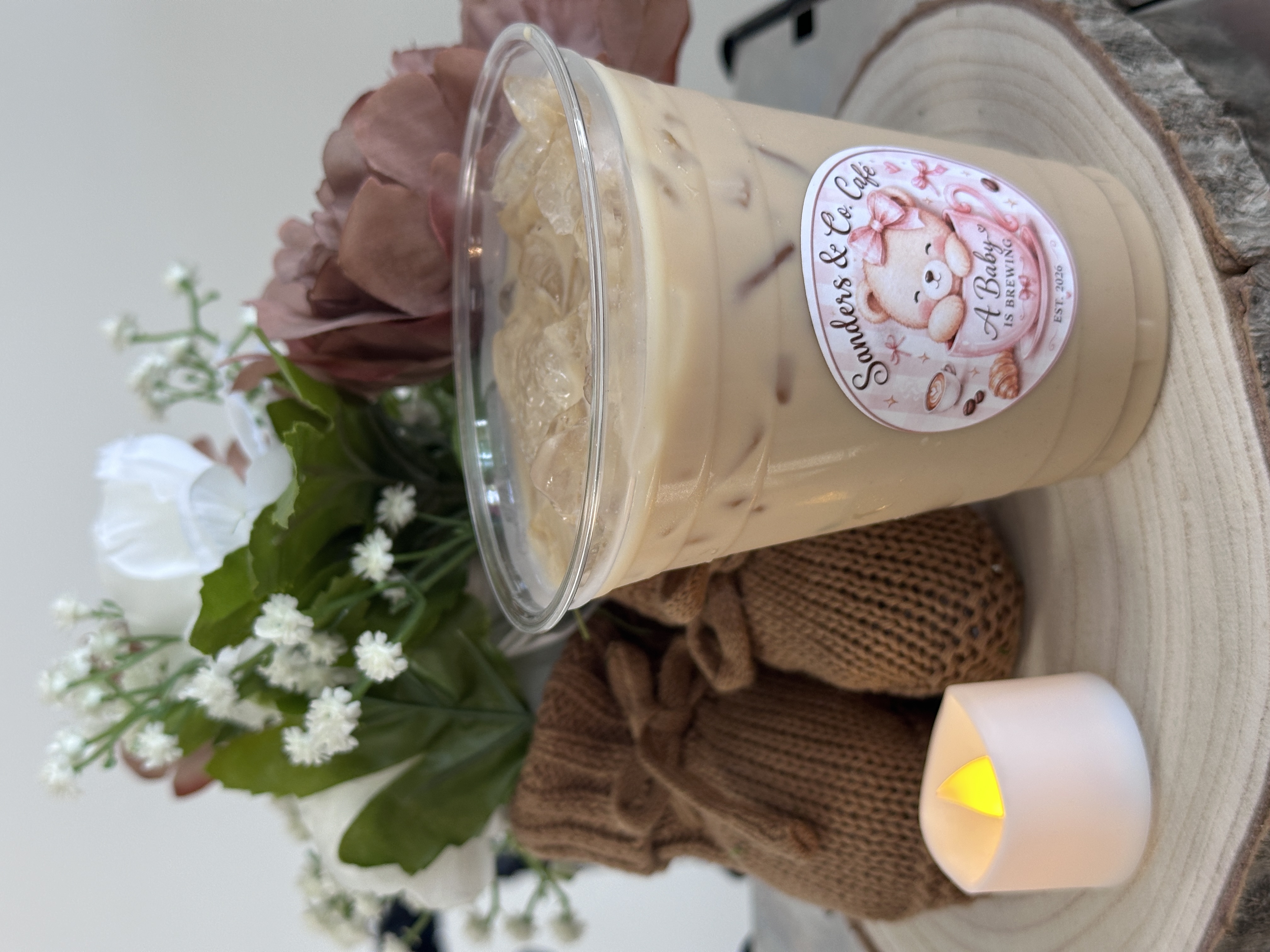 Tee Coffee Studio Sanders and Co Cafe branded iced latte with teddy bear and pink flowers at Atlanta coffee-themed baby shower