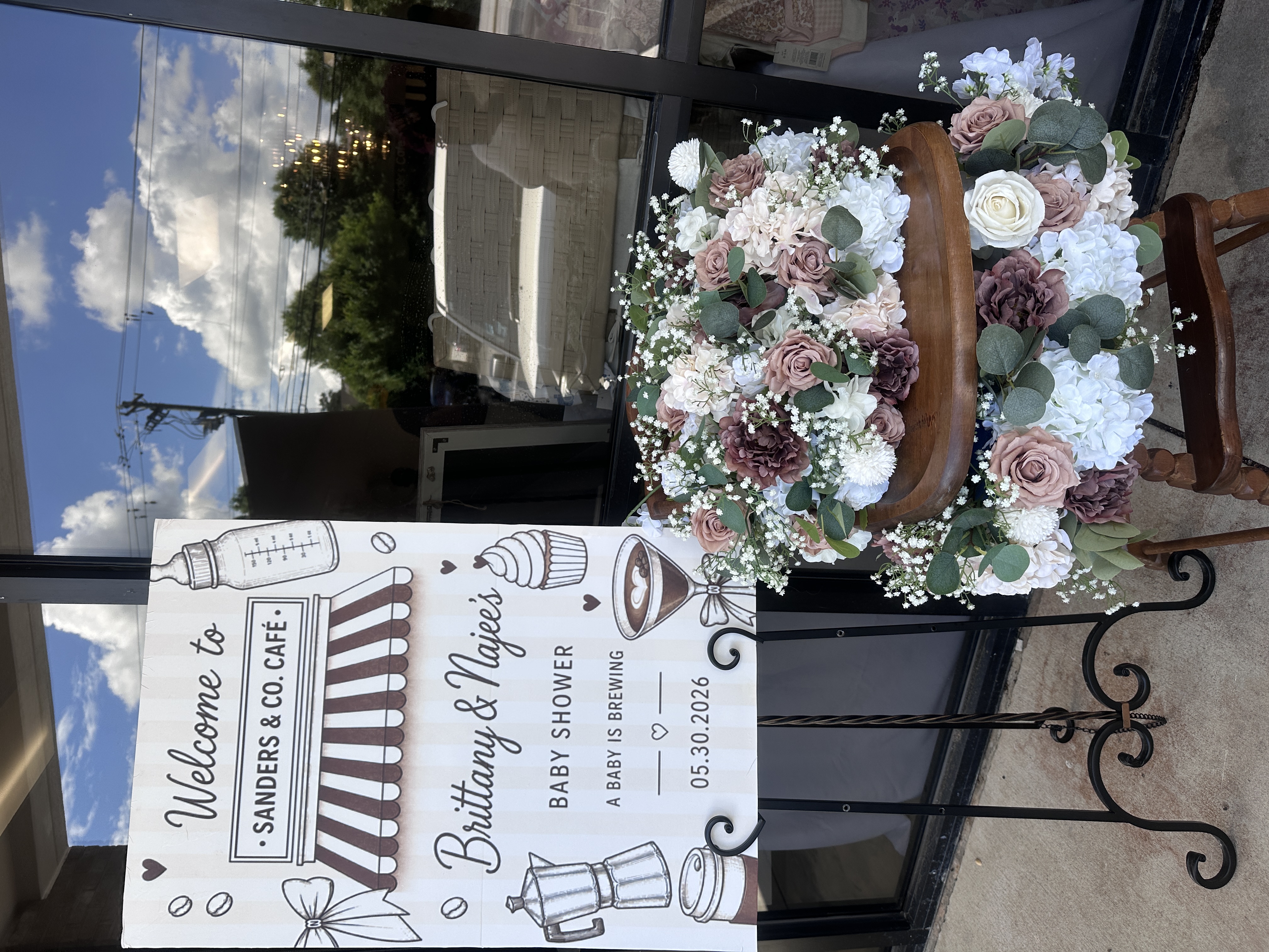 Sanders and Co. Cafe baby shower welcome sign with coffee theme and fresh floral arrangement at Atlanta private event