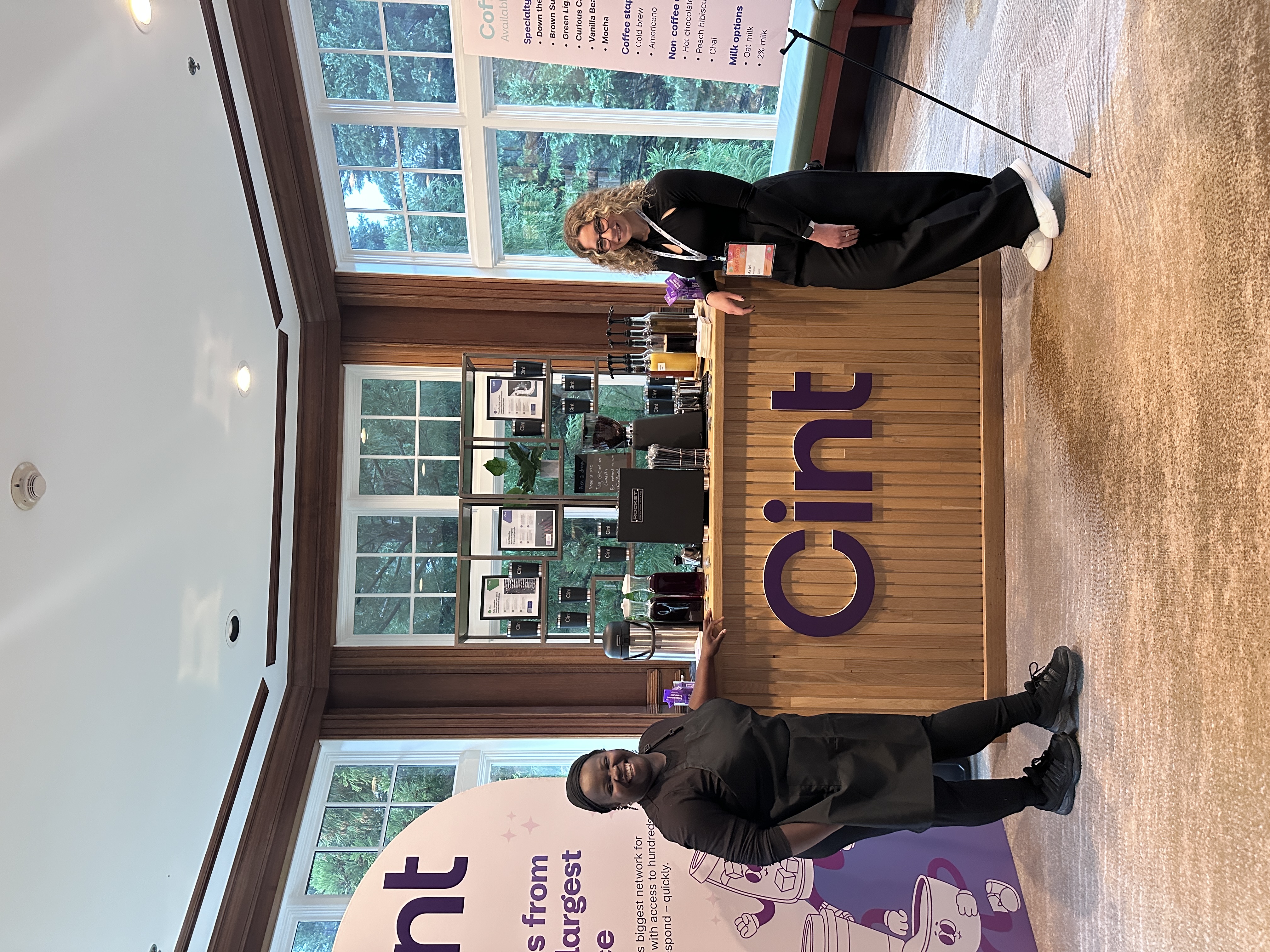 Tee Coffee Studio barista with corporate event client at branded Atlanta coffee bar