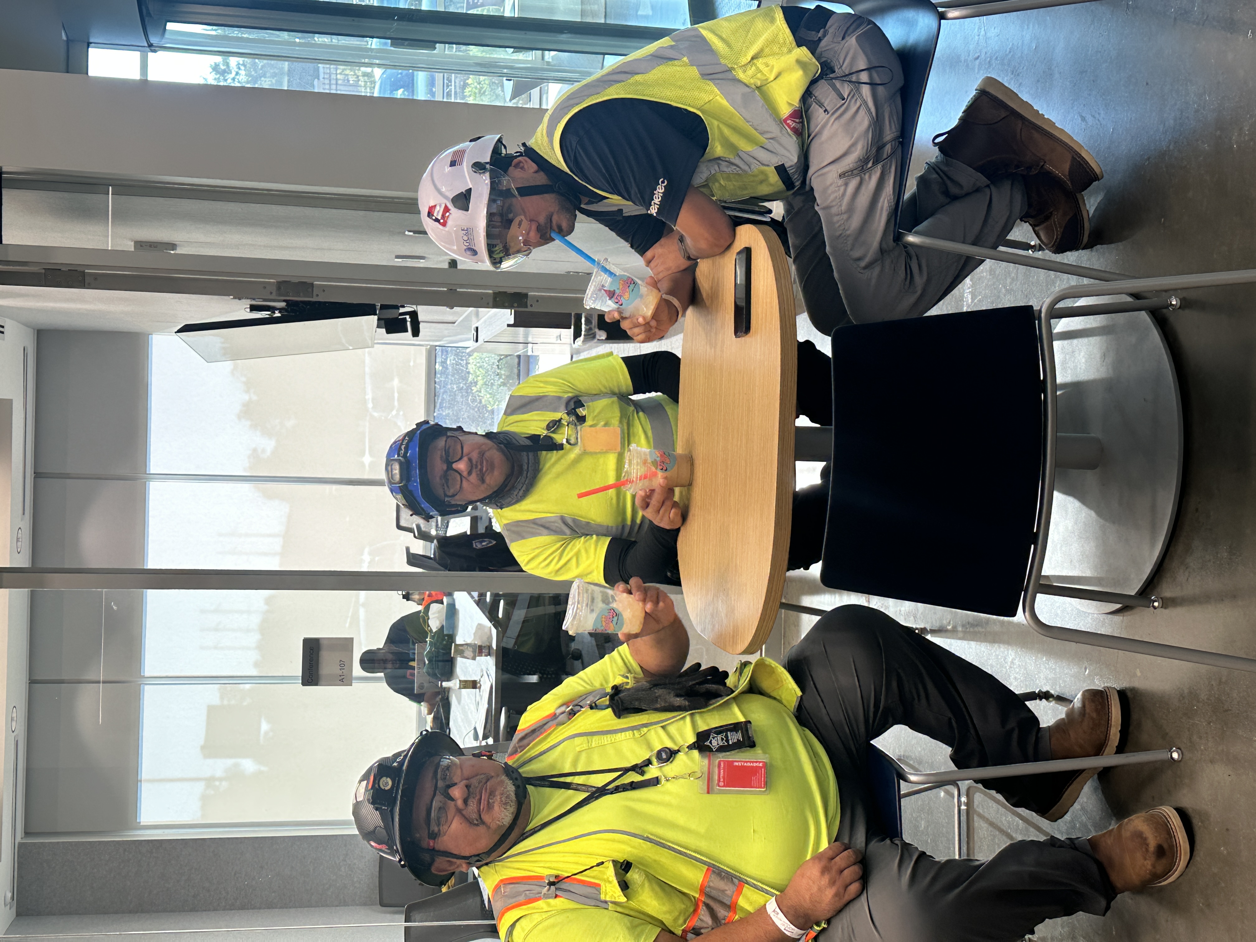 Construction workers enjoying Tee Coffee Studio specialty iced drinks at a corporate event in Atlanta