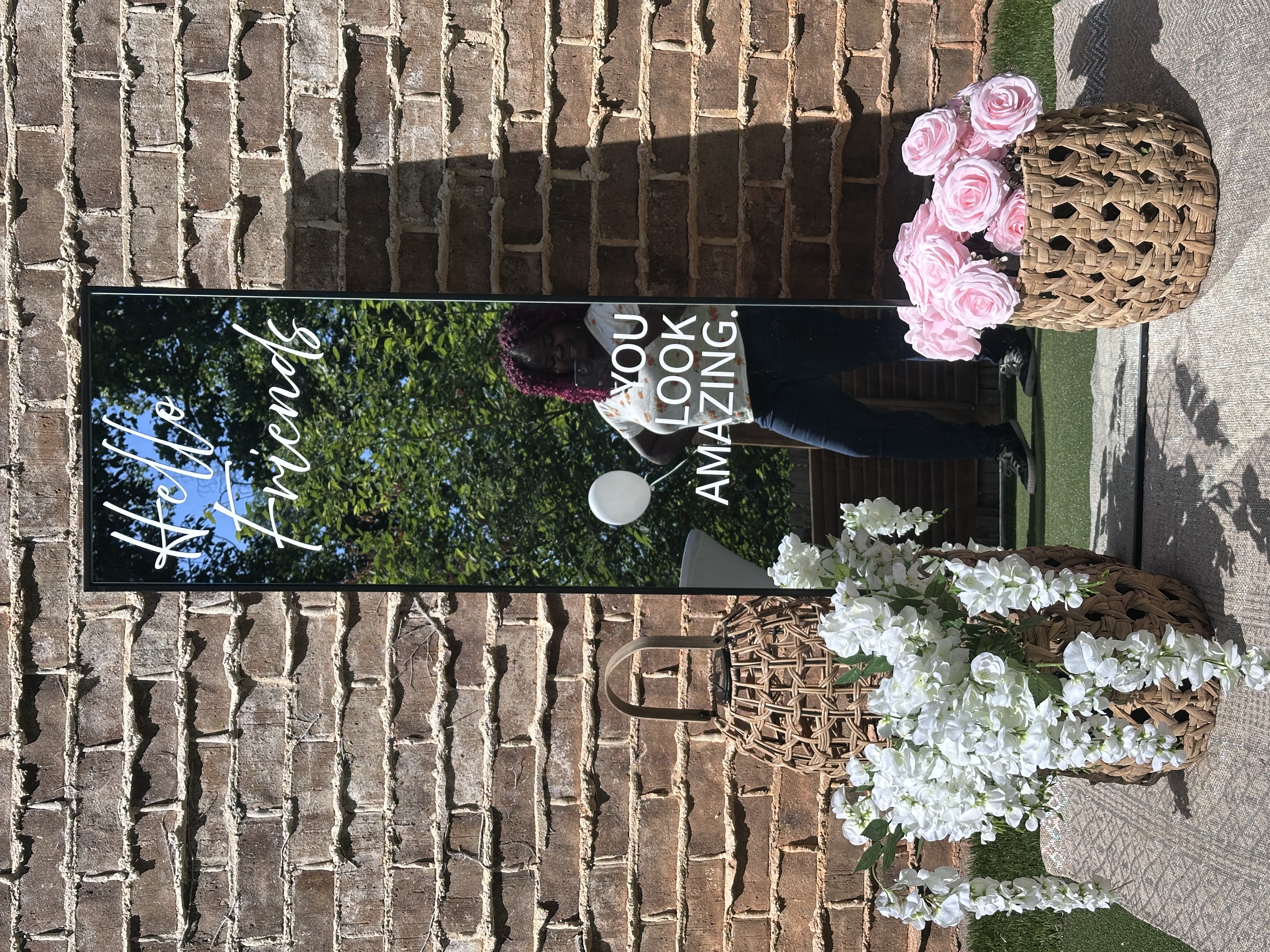 Tee Coffee Studio private event setup with mirror welcome sign and floral arrangements Atlanta celebration
