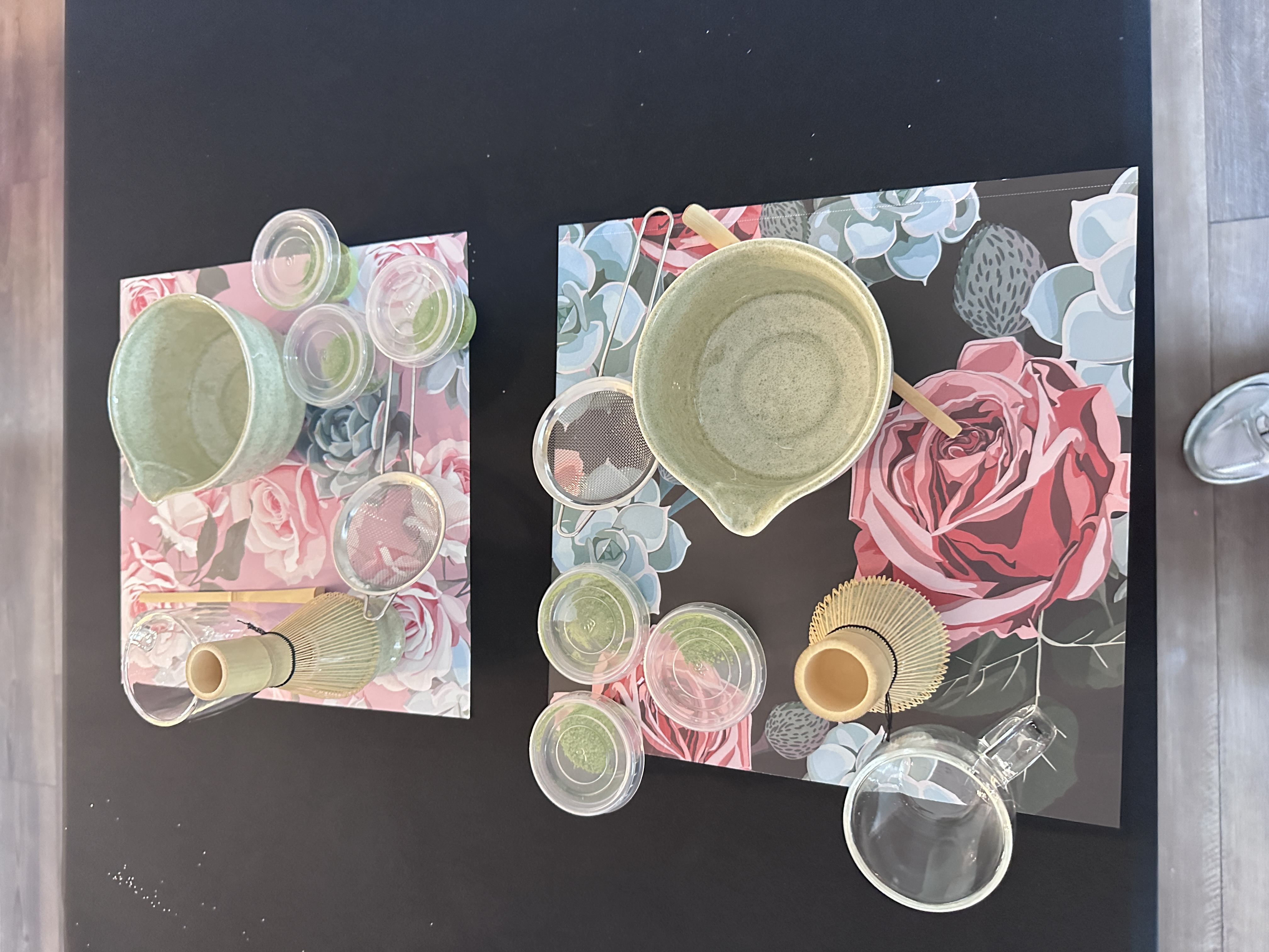 Overhead view of matcha station place settings with bowls, whisks, and matcha portions