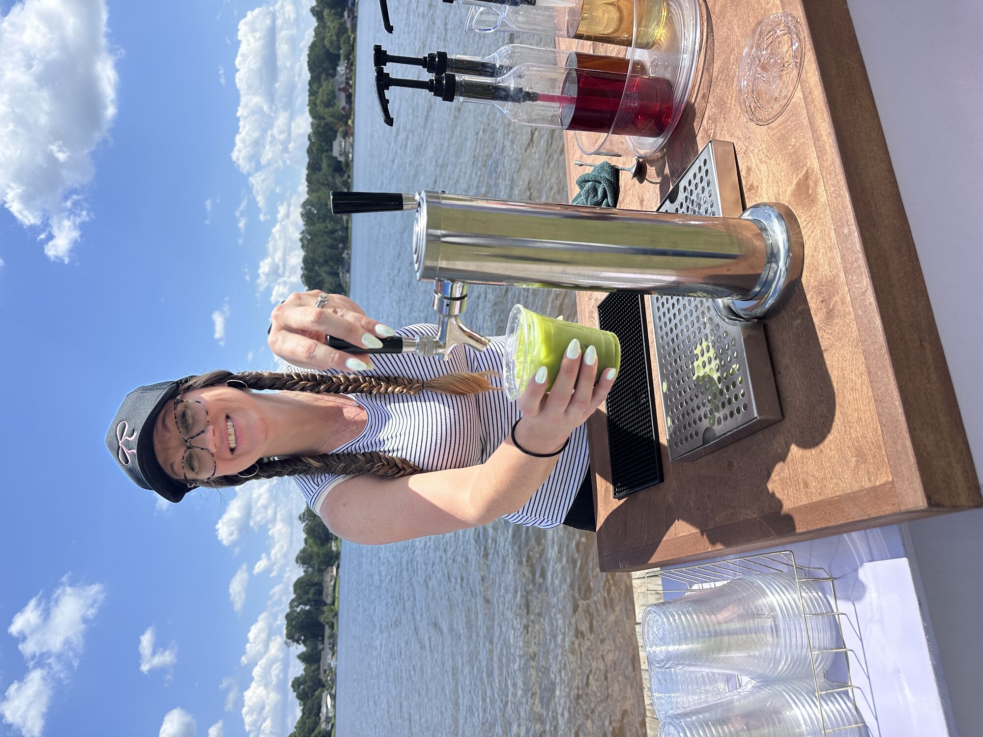 Tee Coffee Studio barista pouring an iced matcha latte from the tap cart