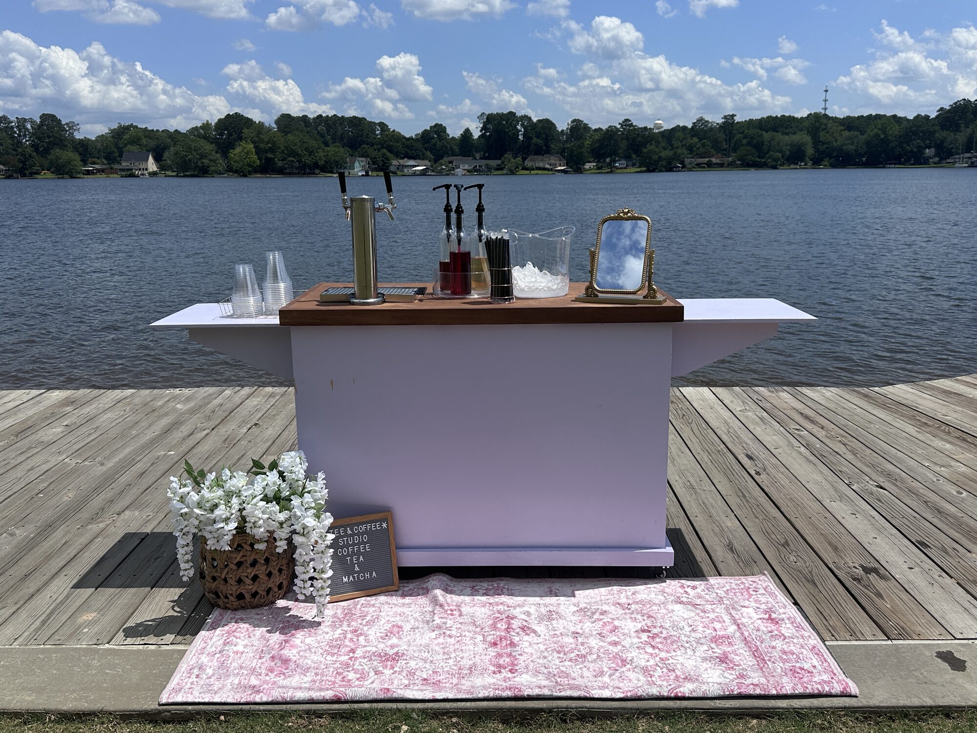 Tee Coffee Studio tap cart styled with flowers and letter board at a lakeside Atlanta event