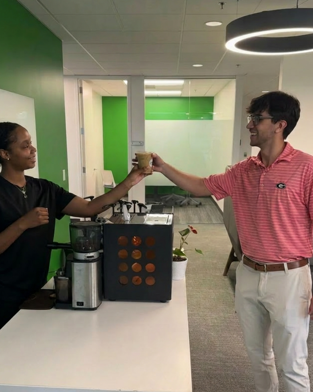 Guests gathering around the Tee Coffee Studio coffee bar during a recurring corporate coffee service in Atlanta
